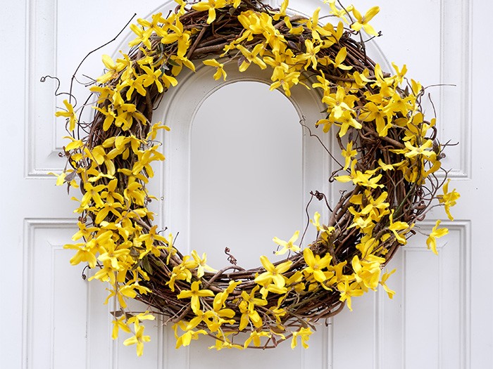 yellow wreath on white door